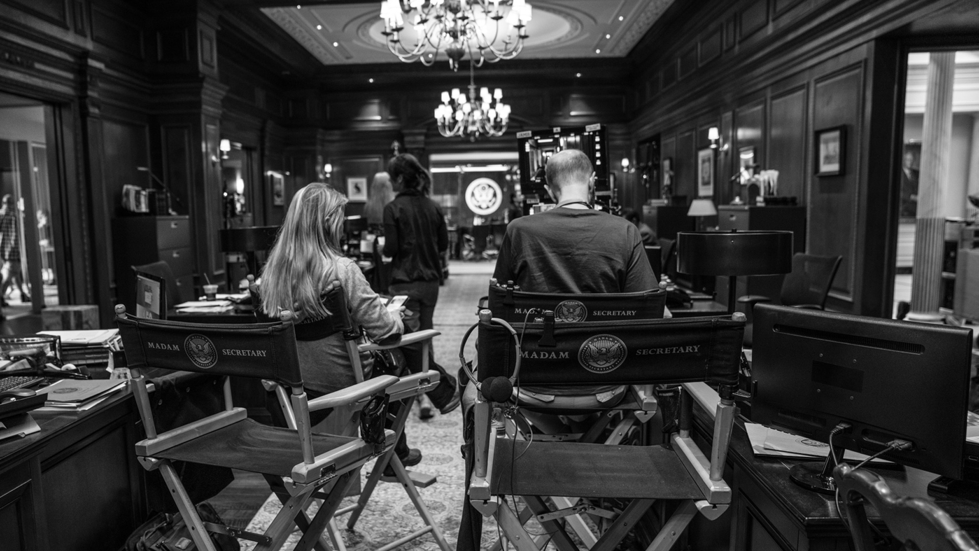 The Madam Secretary crew is hard at work in this black-and-white shot. 
