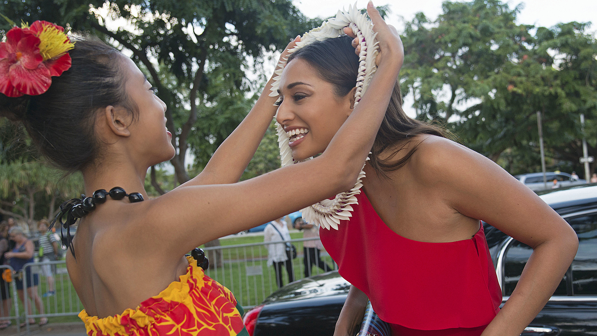 Meaghan Rath receives a lei before entering the celebration.