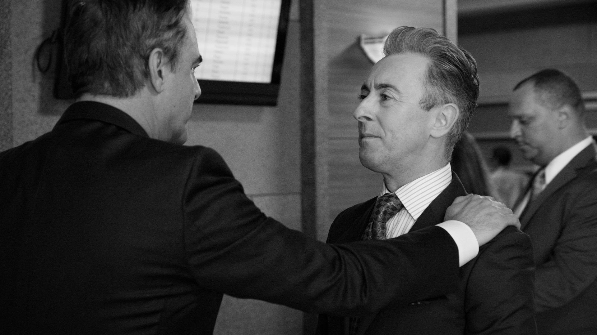 Chris Noth and Alan Cumming share a moment.